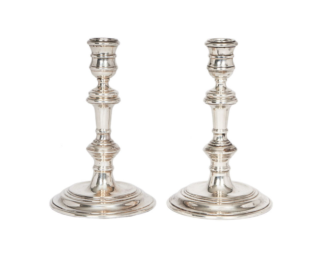 A pair of candlesticks of Baroque style