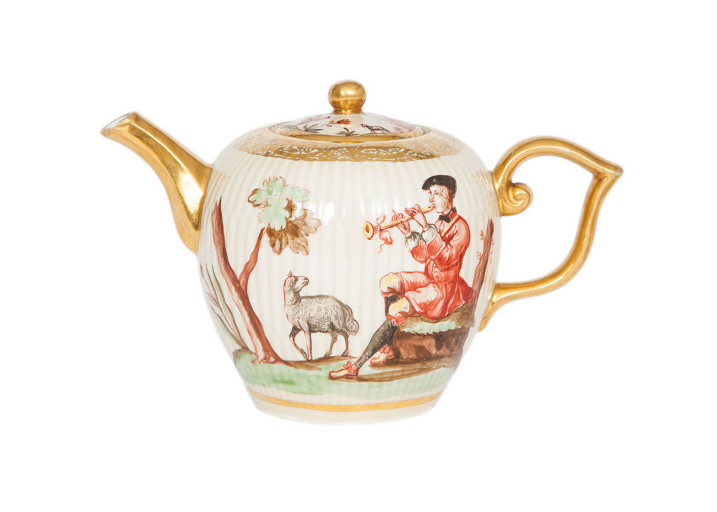 A tea pot with shepherd scenes