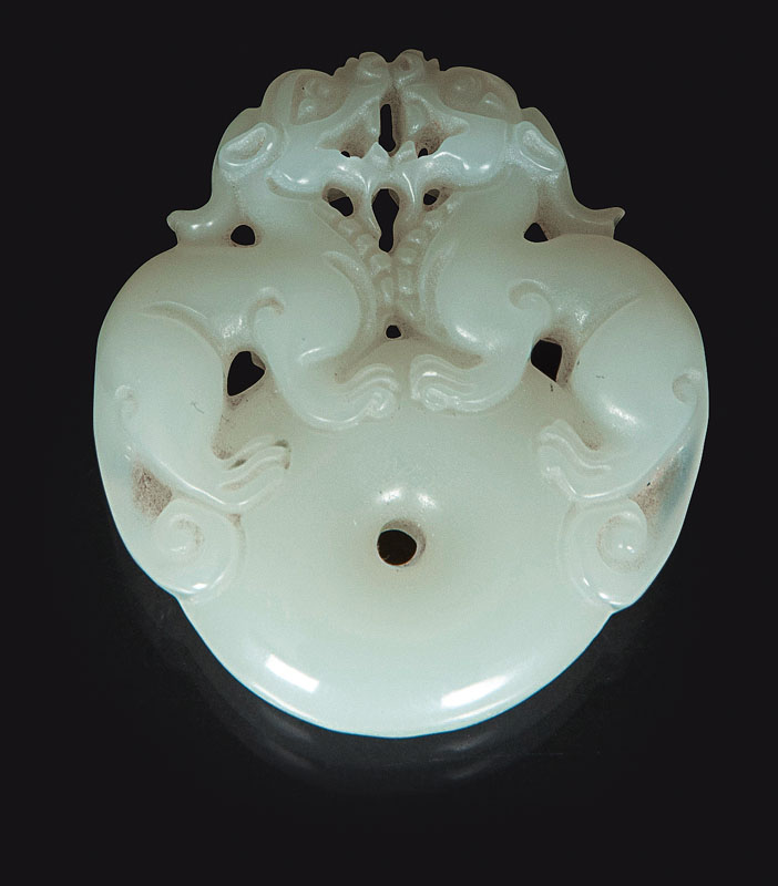 A pure white jade pendant with Qilins