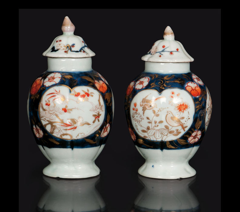 A pair of small Imari lidded jars