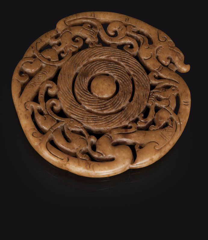 A jade-pendant with mythical beasts