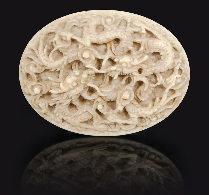 An oval ivory-carving 'Dragons'