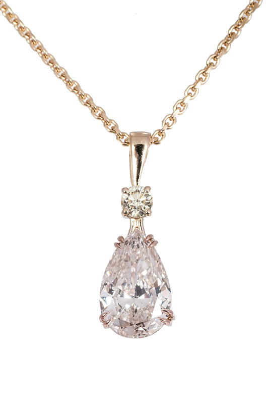 A Fancy diamond pendant in pear shape with necklace