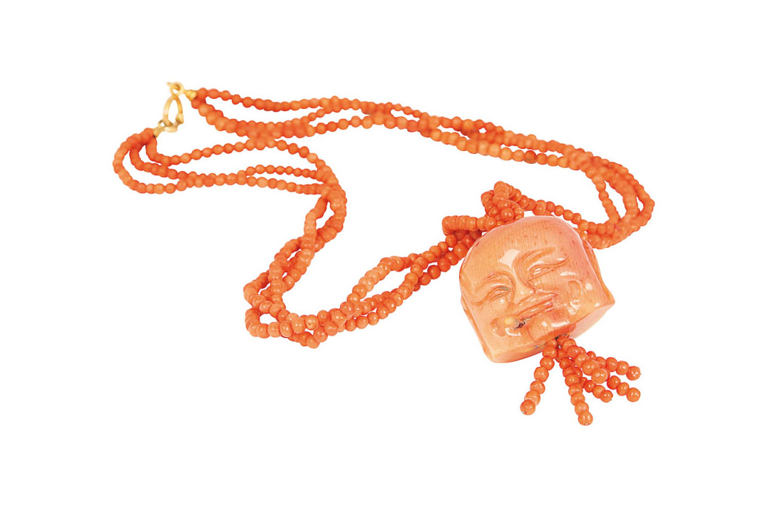A coral necklace with large coral pendant 'Masks'