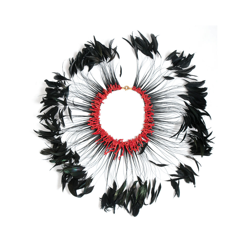 An extravagant coral feather necklace