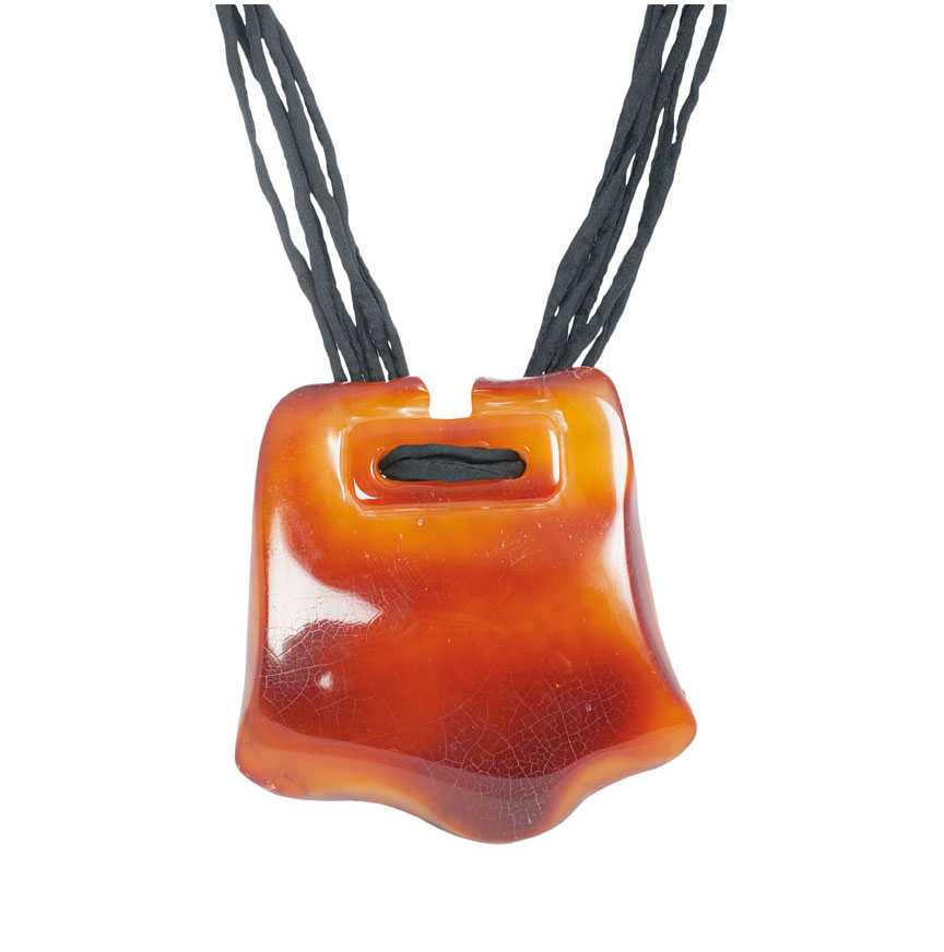 A large amber pendant with cord necklace