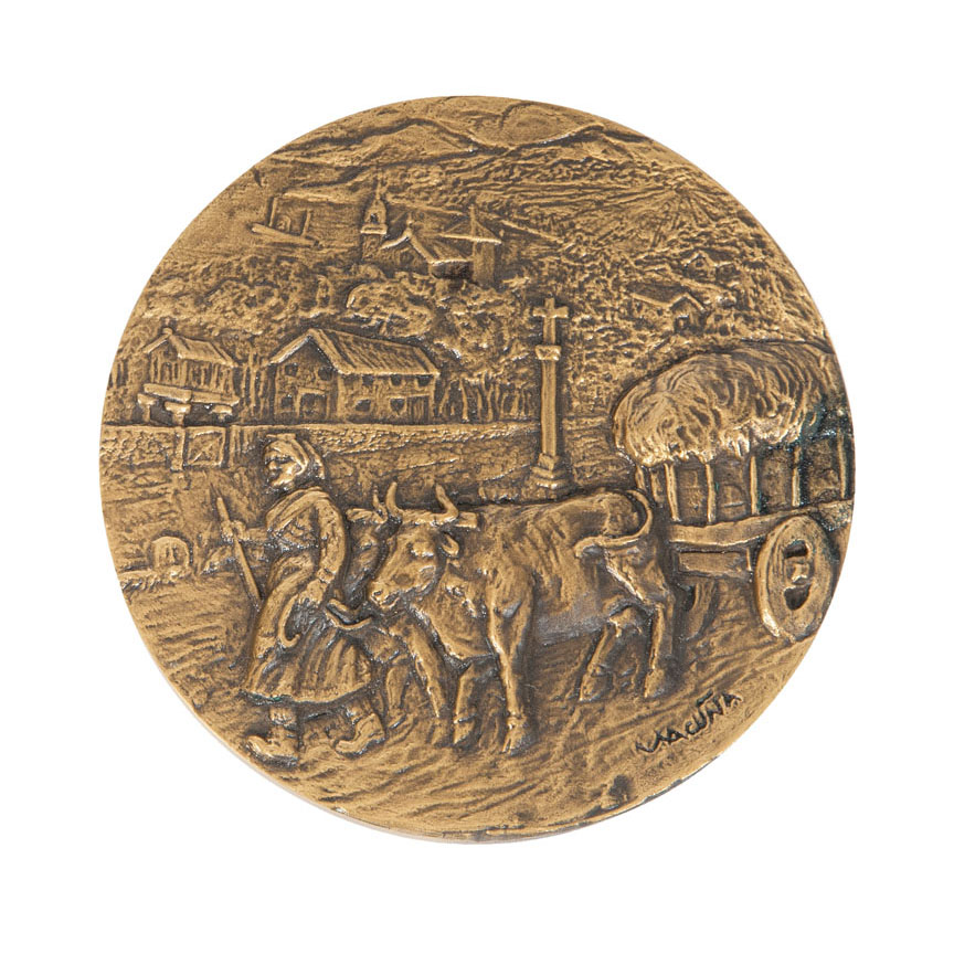 A bronze plaque 'Harvesting'