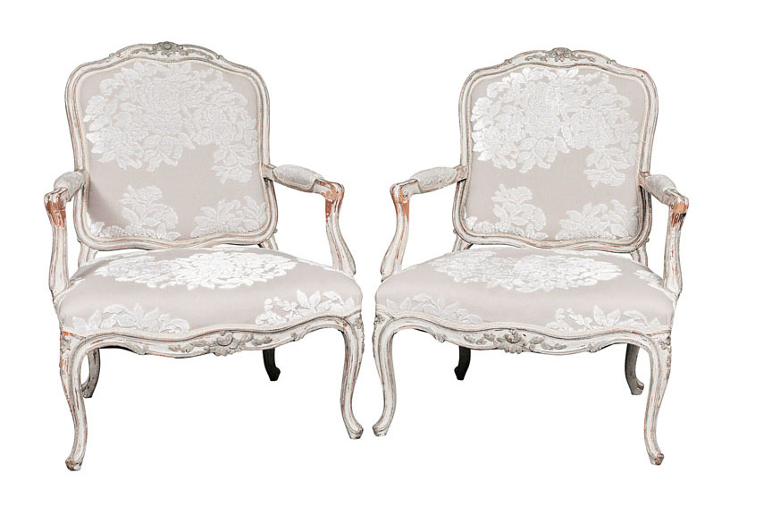 A pair of coloured armchairs of Baroque style