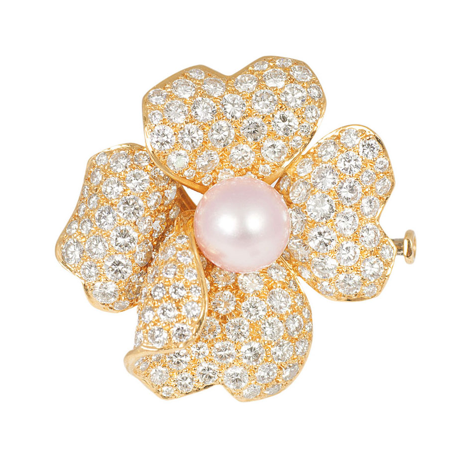 A highcarat diamond flower brooch by Cartier