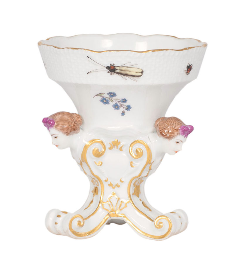 A spice bowl with vivid lady's heads A spice bowl with vivid lady's heads