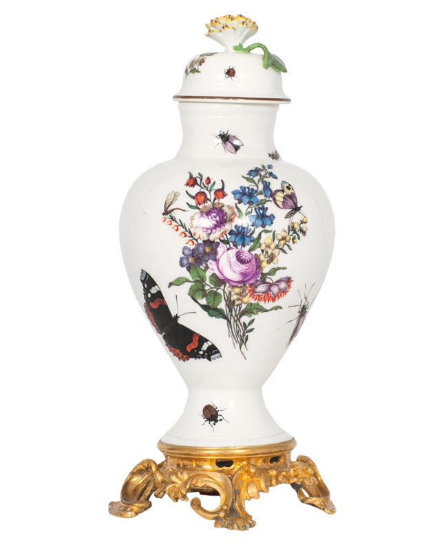 A covered vase with German flowers and insects