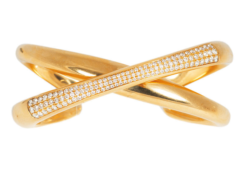 A highcarat golden bangle bracelet with diamonds