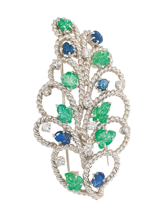 A foliage shaped emerald sapphire brooch