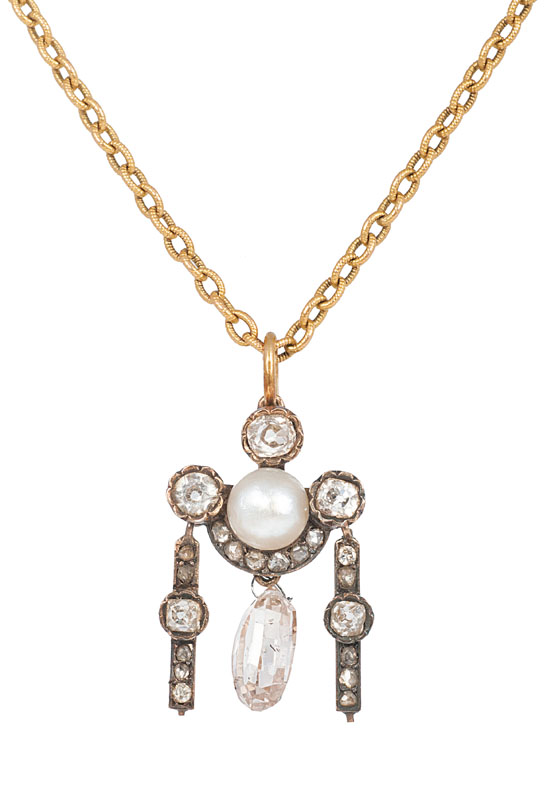 An antique diamond pendant with natural pearl