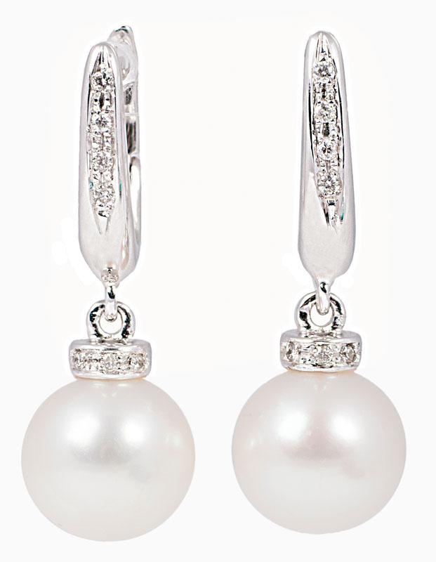 A pair of pearl diamond earrings