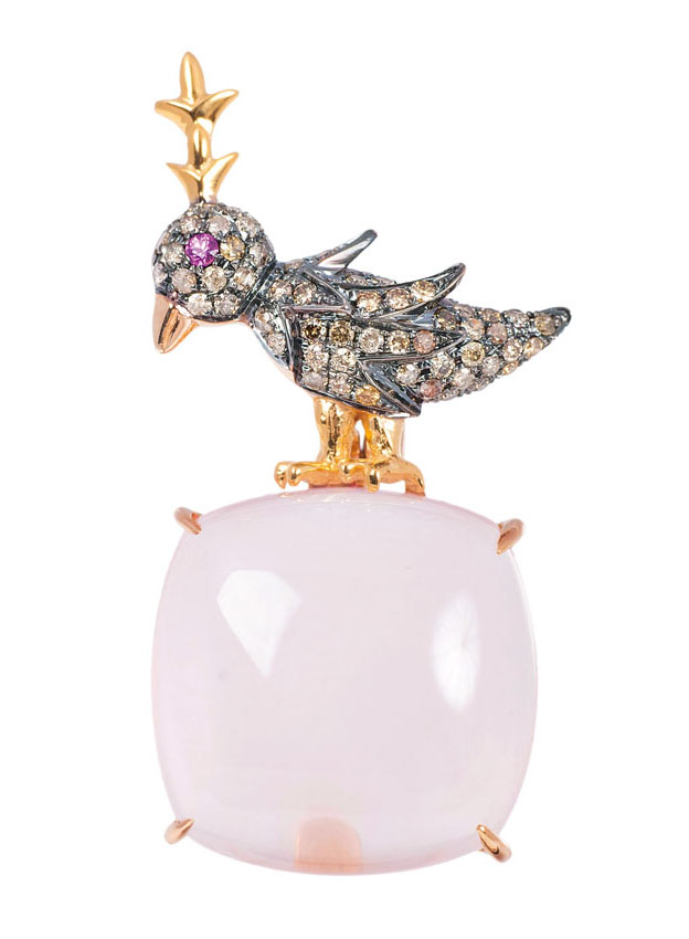 A rose quartz pendant with diamond-figure of a bird