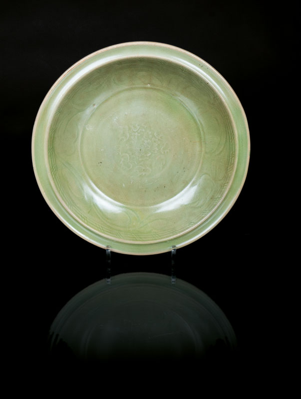 A large celadon plate with floral ornament