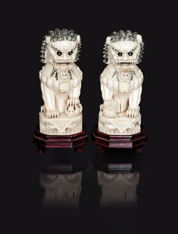 A pair of ivory figures 'Buddhist lions'
