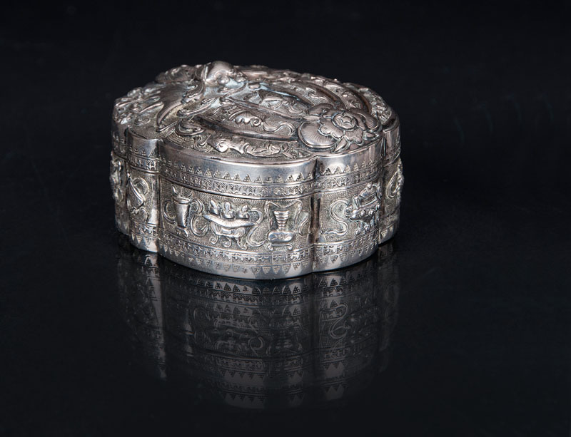 A fine silver box with Buddhist symbols