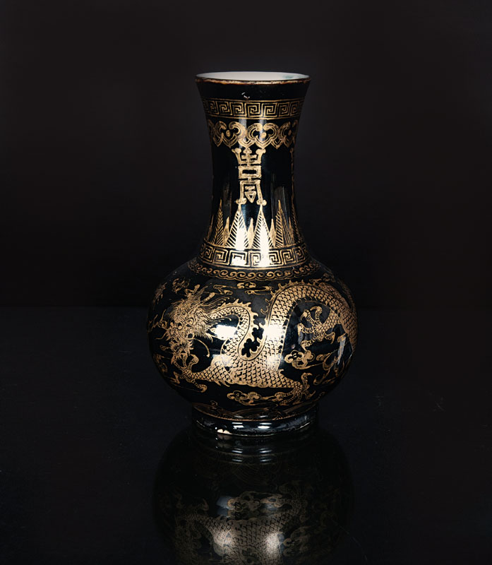 A mirror black bottle vase with auspicious symbols
