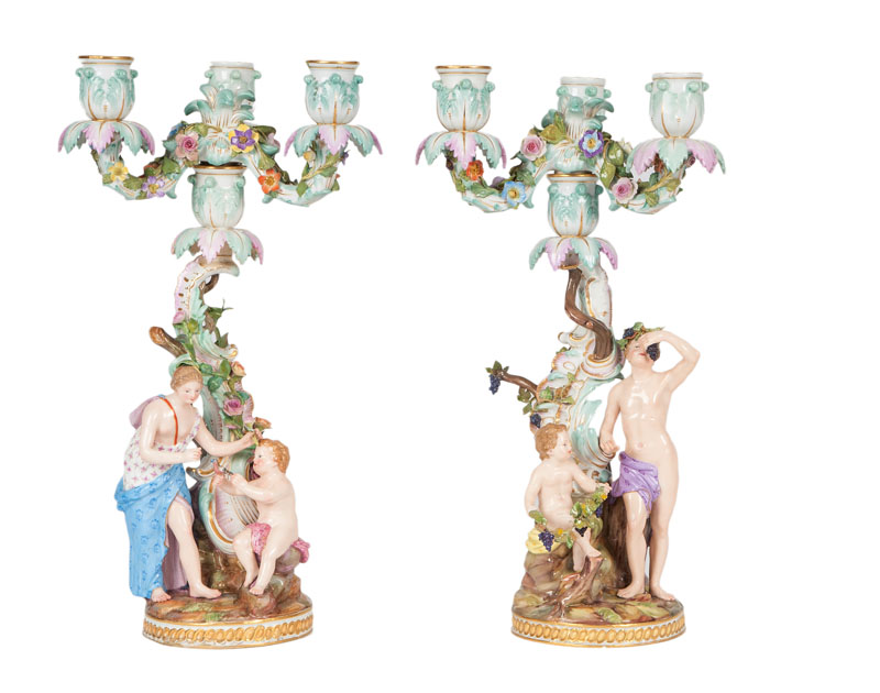 A pair of three-light candelabras of Rococo style with allegories of the seasons