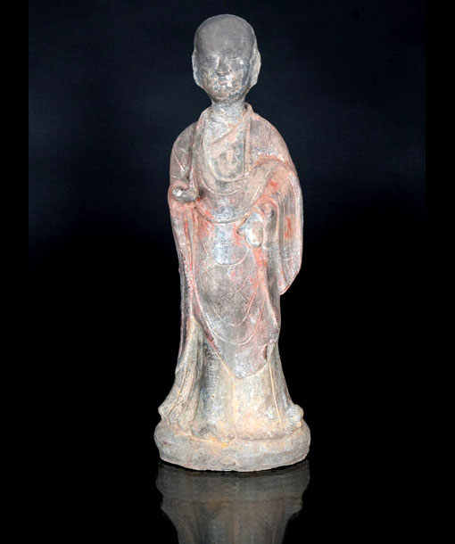 A pottery figure of a dignitary