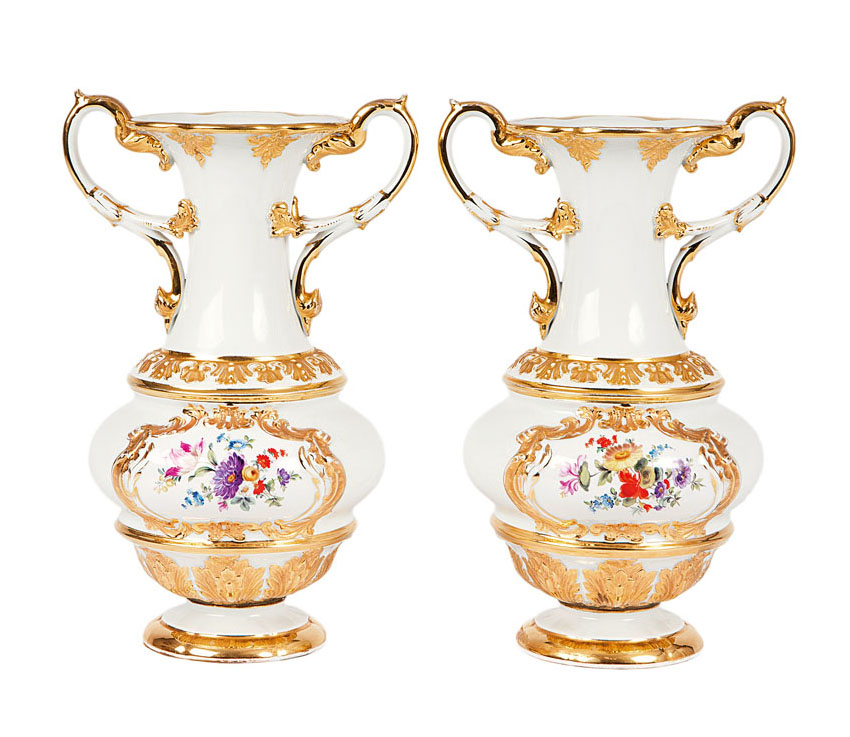 A pair of magnificent vases with rich gilding