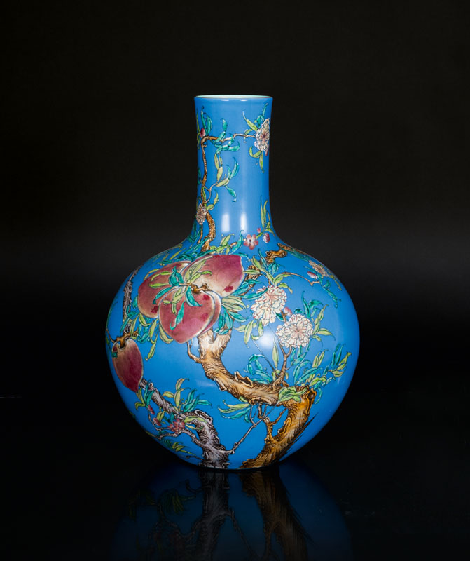 An exceptional blue ground vase with 9 peaches