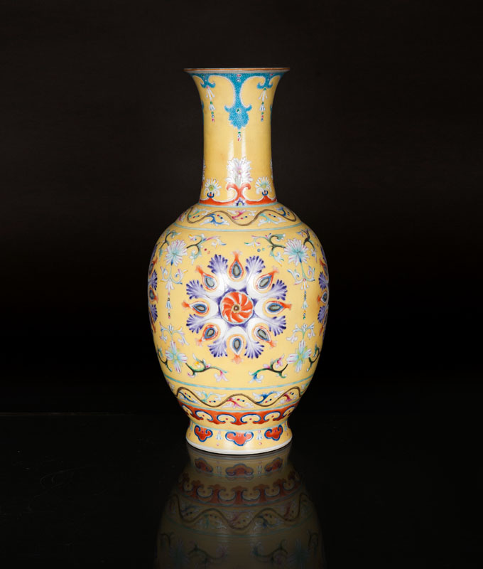 A yellow ground vase with ornaments