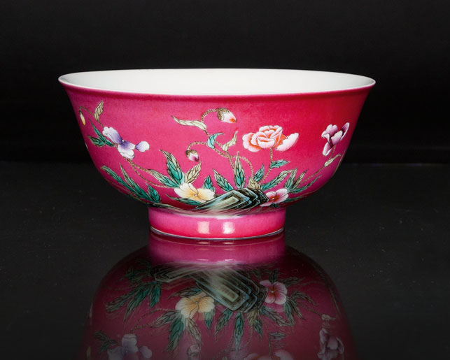 A ruby ground bowl with flowers
