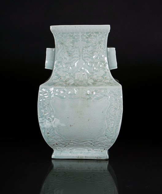 A celadon square-cut vase with reliefed decoration