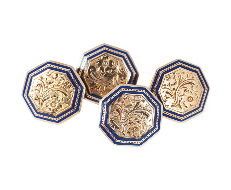 A pair of golden enamel cufflinks