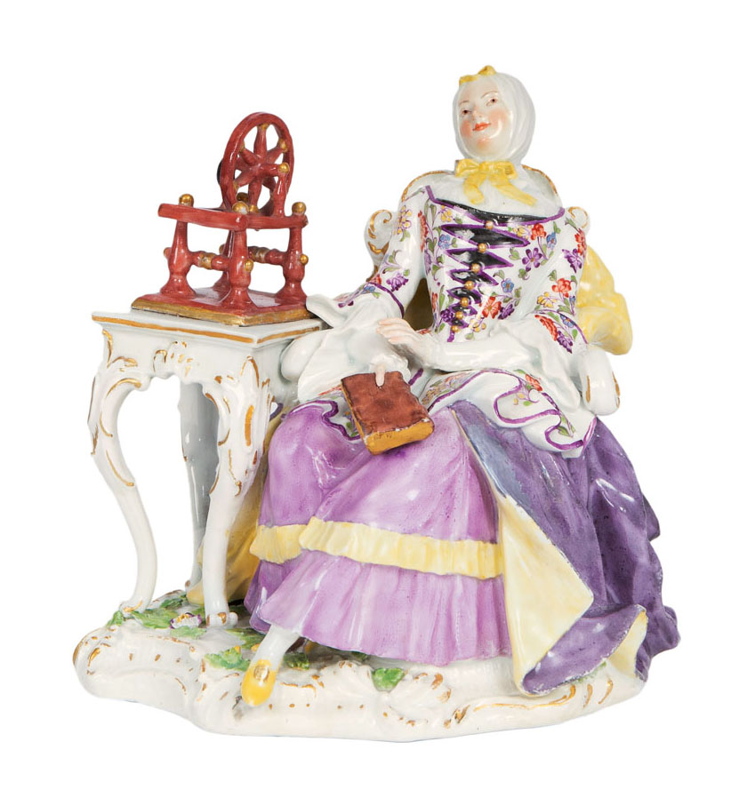A rare Kaendler-figure 'housewife sitting by a spinning wheel' A rare Kaendler-figure 'housewife sitting by a spinning wheel'