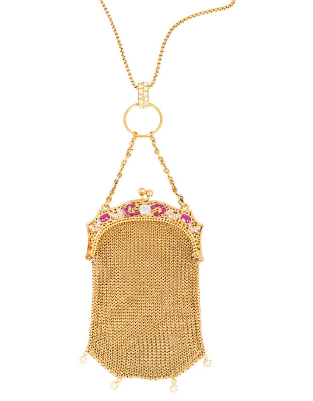 A small Art Nouveau golden evening purse with rubies and diamonds