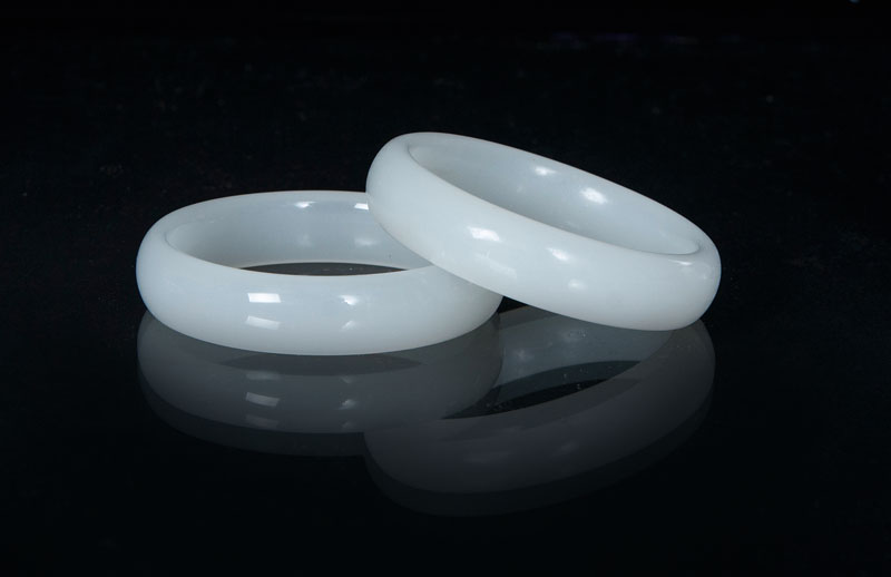 A set of 2 white bangles