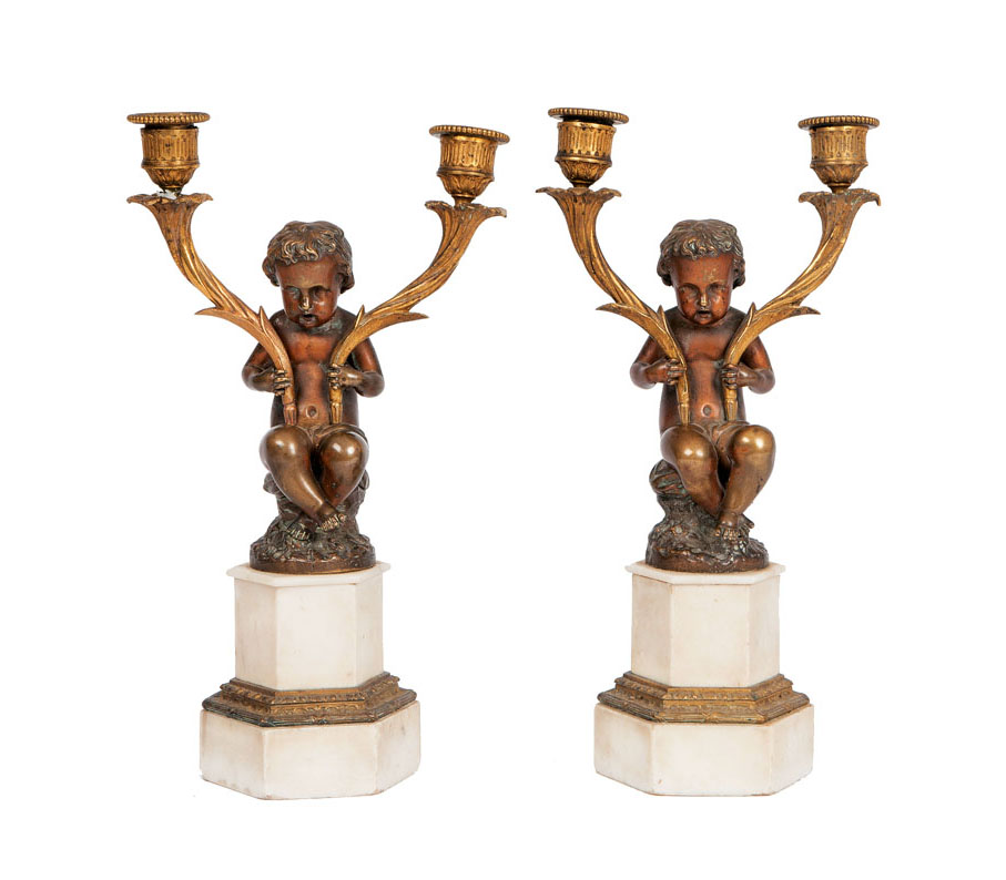 A pair of bronze putti as candle lights