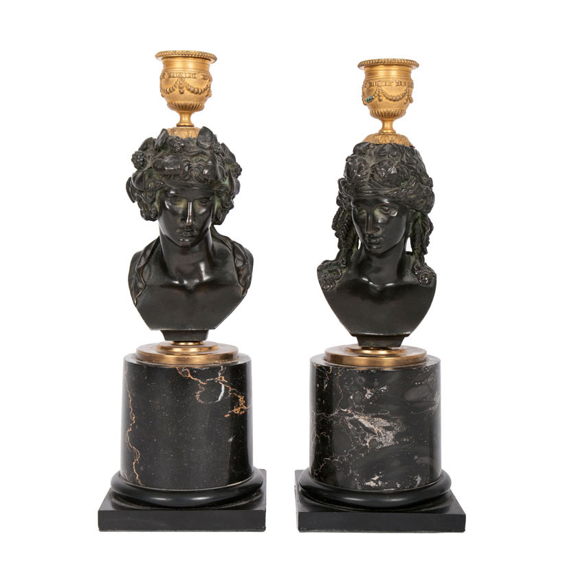 A pair of bronze bustes as candlestick