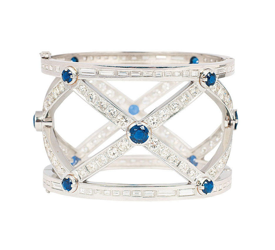 An extraordinary platinum bangle bracelet with diamonds and sapphires