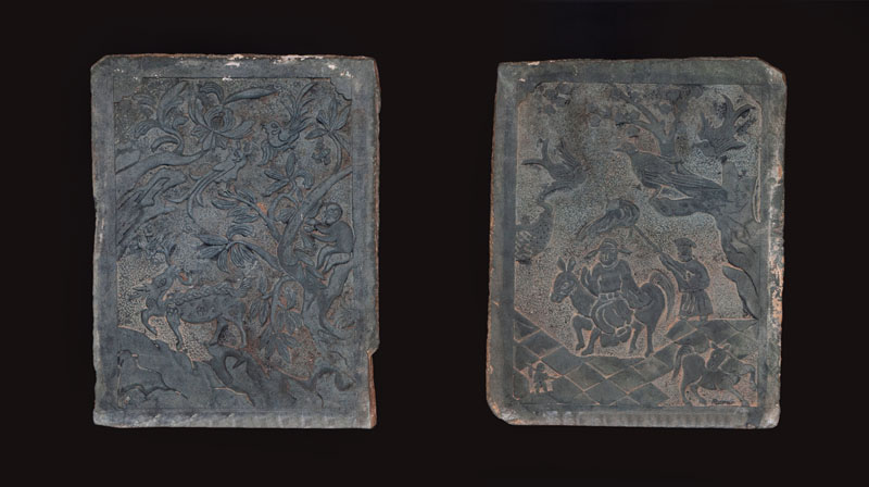A pair of large stone screens with figural scenes A pair of large stone screens with figural scenes