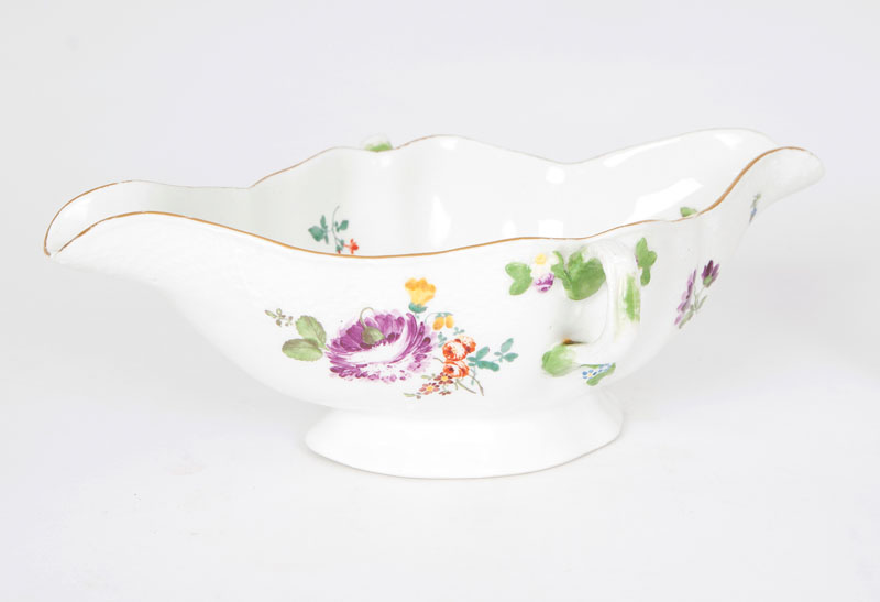 A gravy boat with flower painting