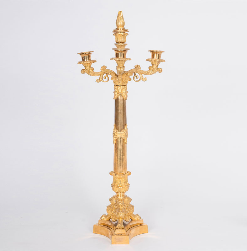 A large candle holder with Empire ornaments