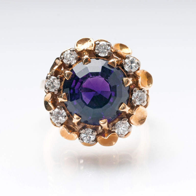 An amethyst diamond ring