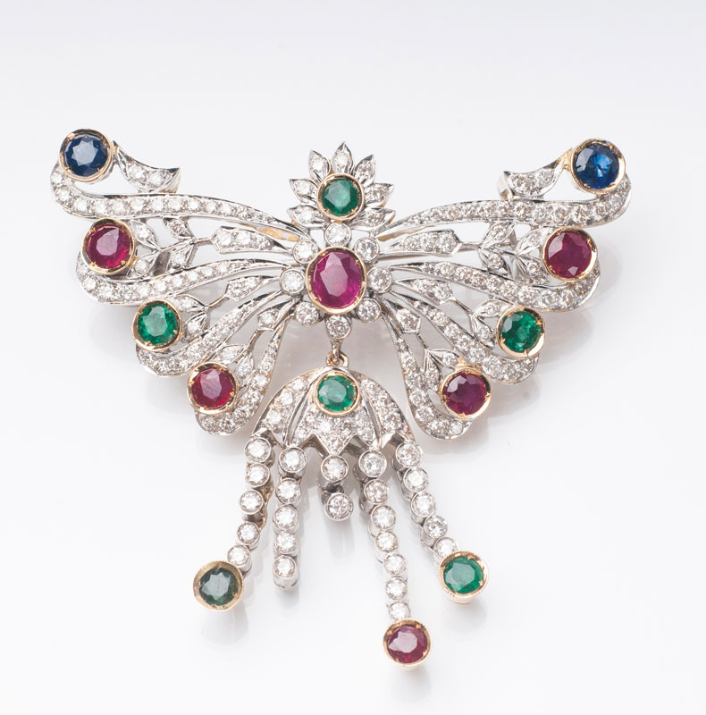 A colourful sapphire ruby emerald brooch with diamonds