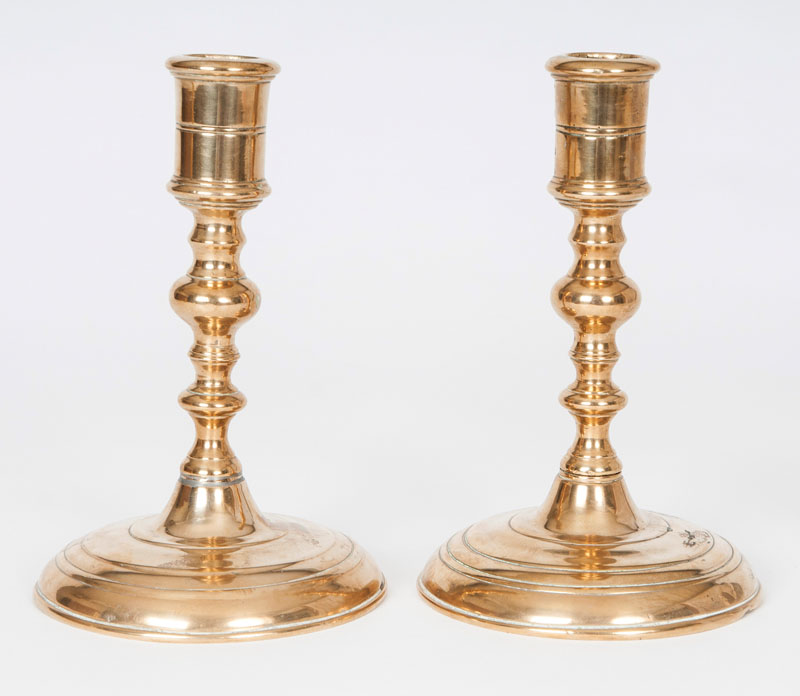 A pair of brass candlesticks