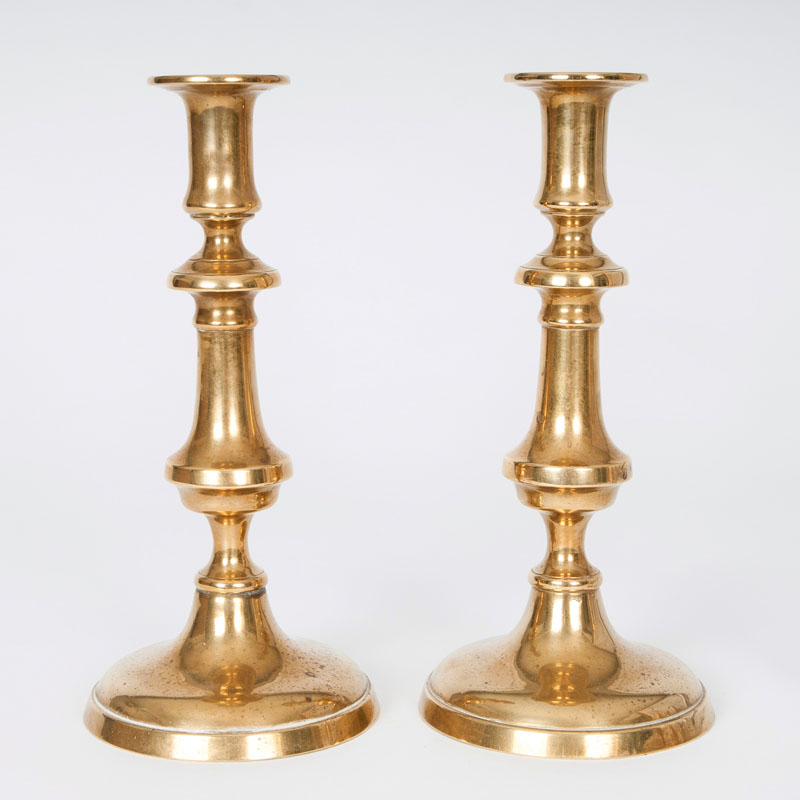 A pair of brass candlesticks