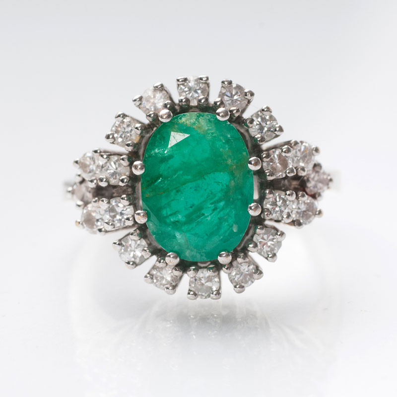 An emerald diamond ring