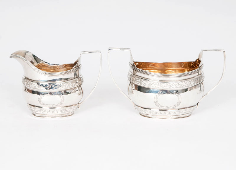 A set of creamer and sugar bowl with classical engraved pattern