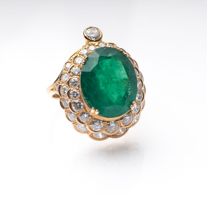 An emerald diamond ring