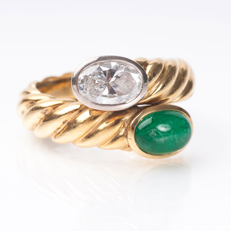 An emerald diamond ring