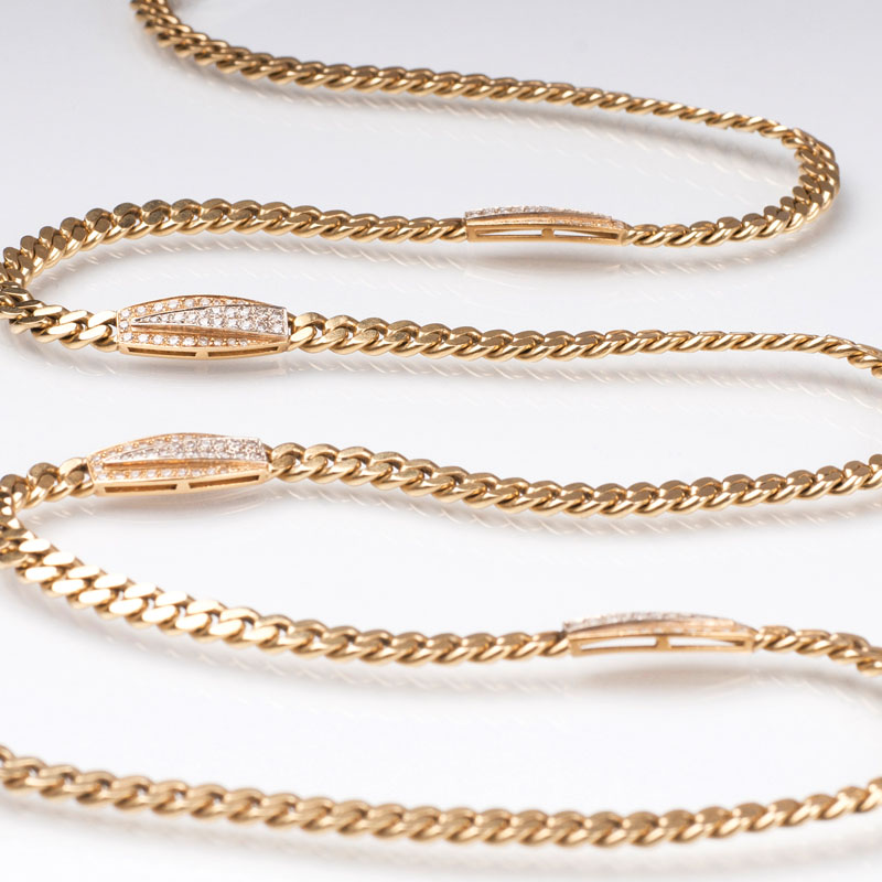 A very long curb chain necklace with diamonds by Jeweller Bucherer